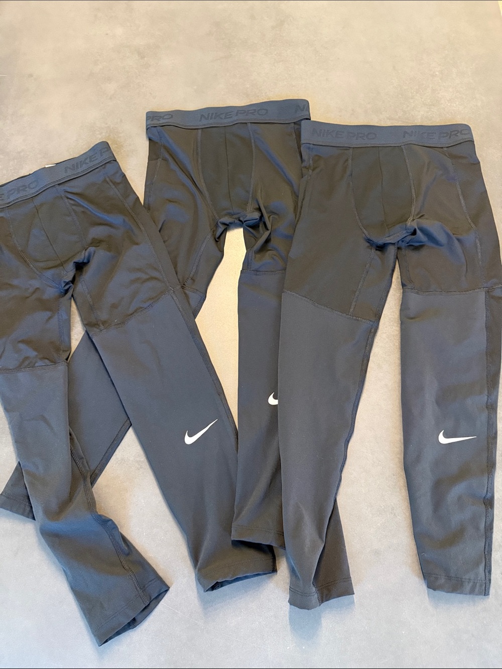 Nike Black Kids Performance Leggings with White Swoosh. Bundle of 3.